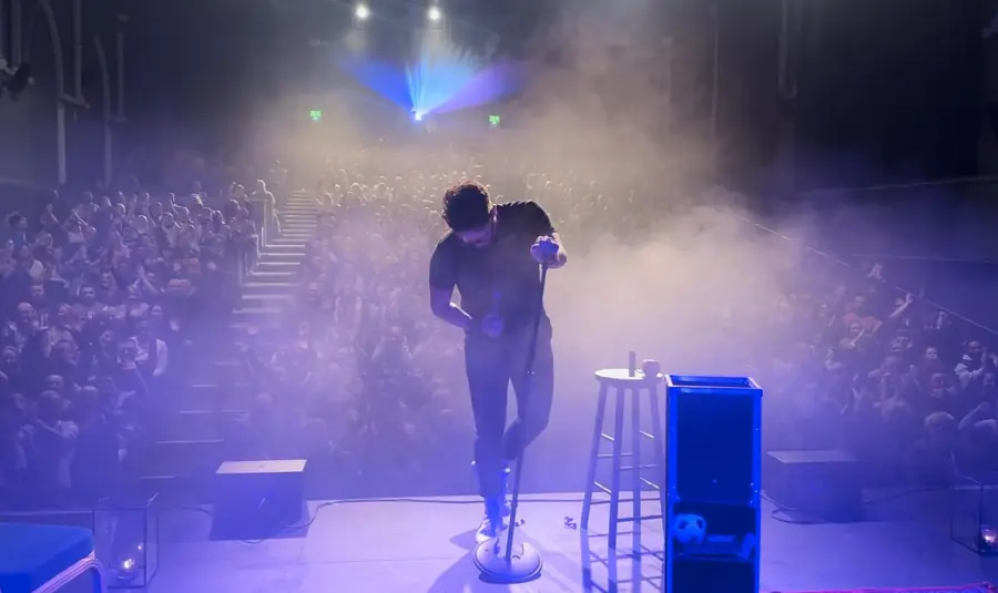 Smoke, lights and a packed room
